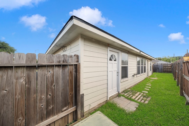 view of home's exterior featuring a yard