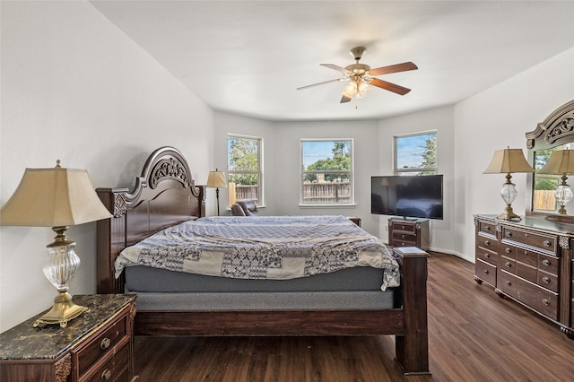 bedroom with dark wood-type flooring and ceiling fan