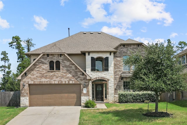 view of front of house with a front lawn and a garage