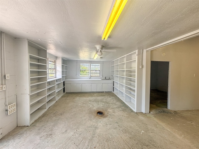 unfurnished room with ceiling fan