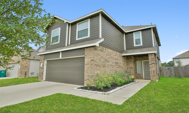 view of front of home with a garage and a front lawn