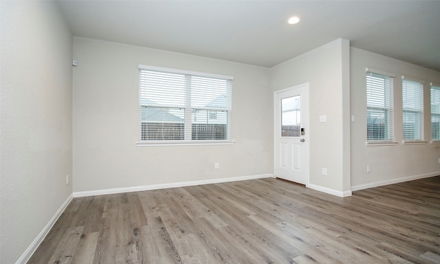 spare room with hardwood / wood-style floors