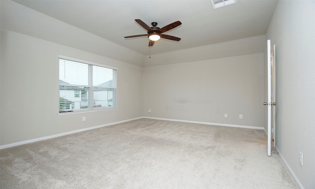 unfurnished room featuring light colored carpet and ceiling fan