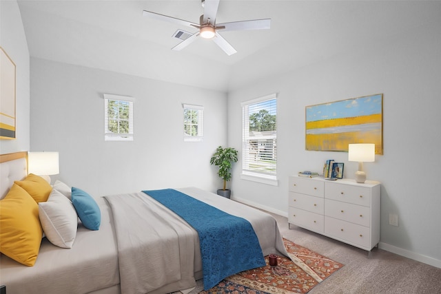 bedroom with ceiling fan and light carpet