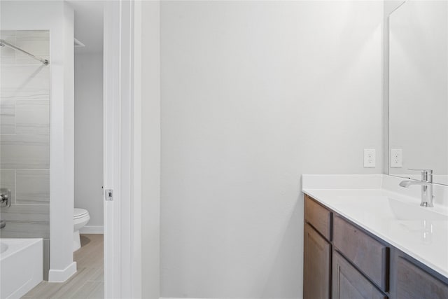 full bathroom with shower / bath combination, vanity, and toilet