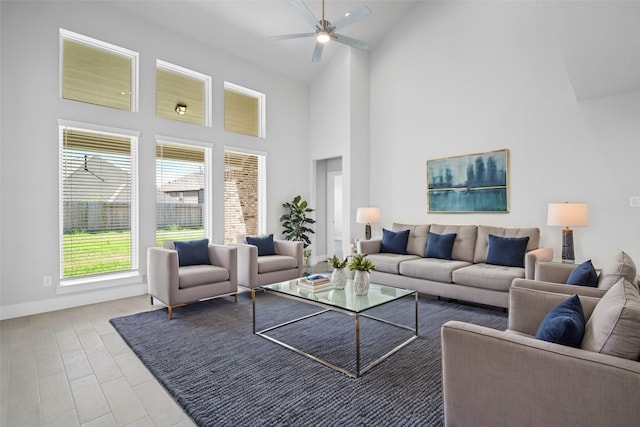 living room featuring high vaulted ceiling and ceiling fan