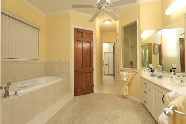 bathroom featuring vanity, tile patterned flooring, crown molding, a relaxing tiled tub, and ceiling fan