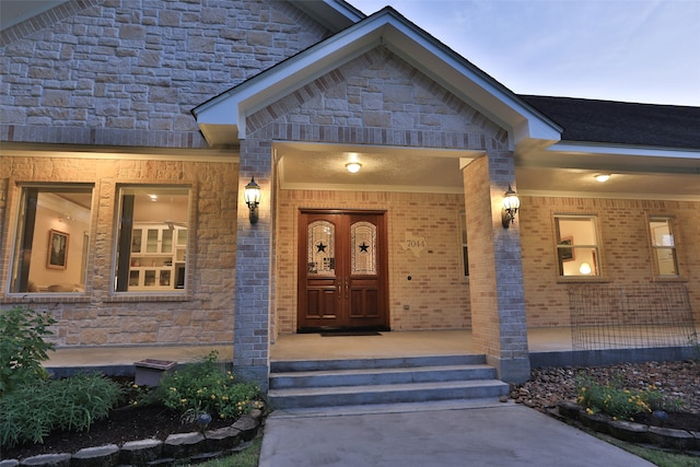 exterior entry at dusk with a porch