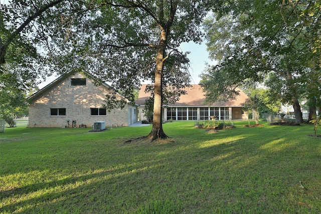 view of yard featuring central AC