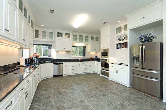 kitchen featuring appliances with stainless steel finishes and white cabinets