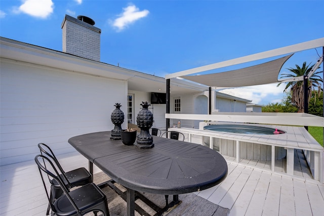 wooden terrace featuring an in ground hot tub