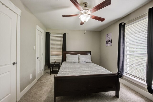 carpeted bedroom featuring ceiling fan