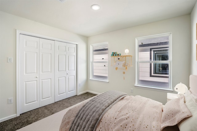 carpeted bedroom with a closet