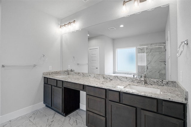 bathroom featuring vanity and a shower with door