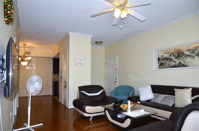 living room featuring crown molding, dark wood-type flooring, and ceiling fan with notable chandelier