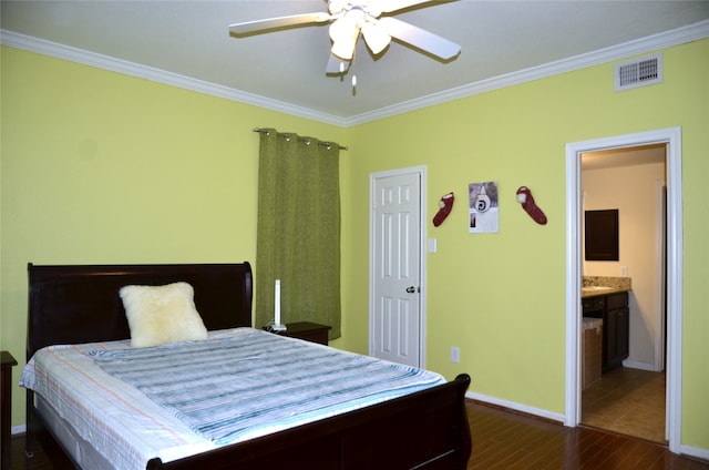 bedroom featuring crown molding, connected bathroom, ceiling fan, and dark hardwood / wood-style floors