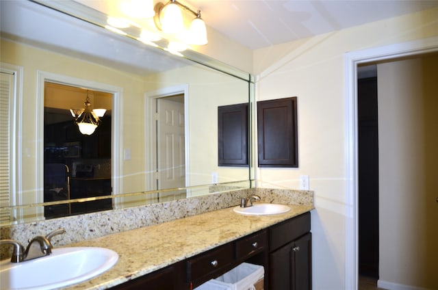 bathroom featuring vanity and an inviting chandelier