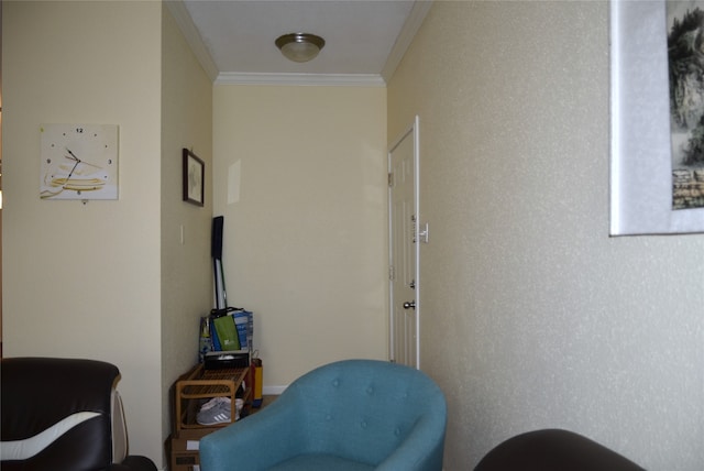 sitting room with crown molding