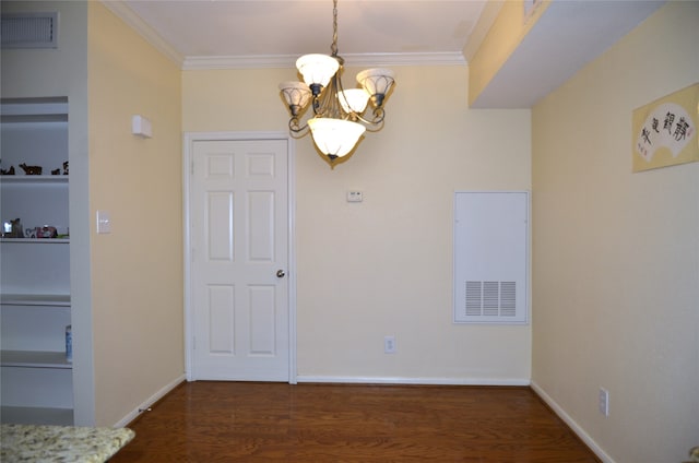 unfurnished dining area with crown molding, dark hardwood / wood-style floors, and a notable chandelier