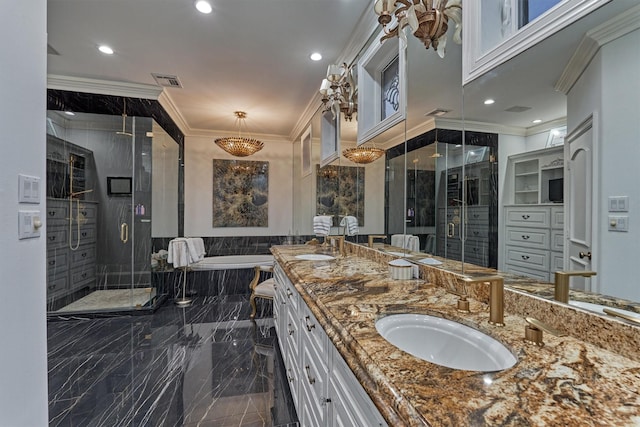 bathroom featuring marble finish floor, a stall shower, crown molding, and a sink