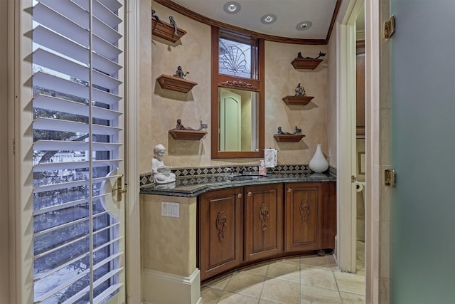 bathroom with tile patterned flooring and vanity