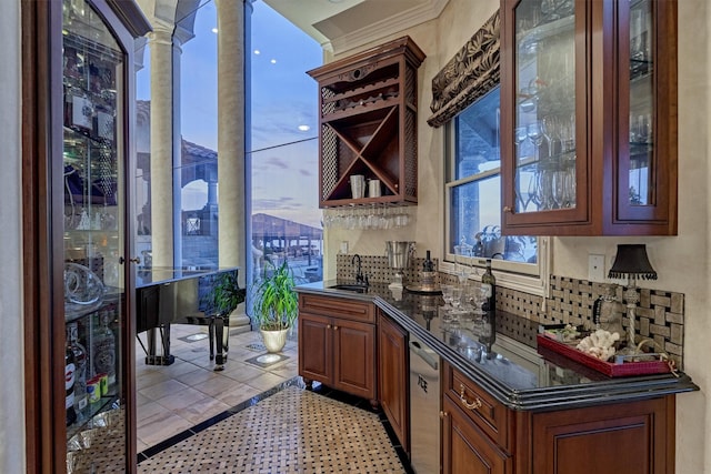 bar featuring tasteful backsplash, plenty of natural light, dishwasher, and a sink