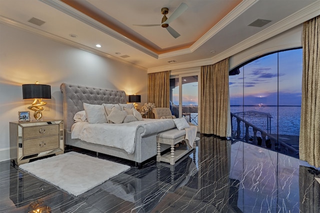 bedroom with crown molding, a water view, a raised ceiling, access to exterior, and ceiling fan