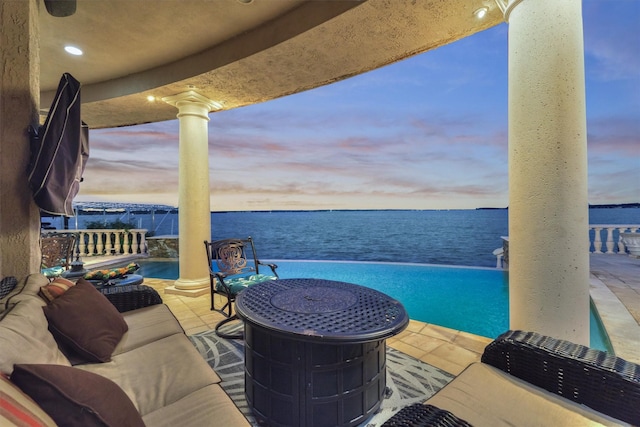 view of patio / terrace featuring an outdoor living space and a water view