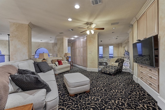 carpeted living area with visible vents, recessed lighting, and ornamental molding