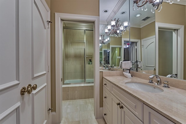 full bath with vanity, tiled shower / bath, visible vents, and ornamental molding