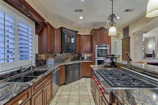 kitchen featuring light tile patterned floors, stainless steel appliances, decorative backsplash, a chandelier, and dark stone counters