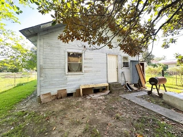 back of house with a yard