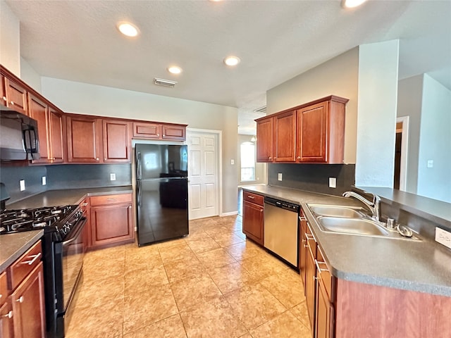 kitchen with black appliances, sink, and light tile patterned flooring