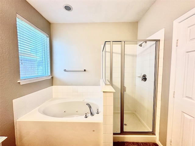 bathroom with separate shower and tub