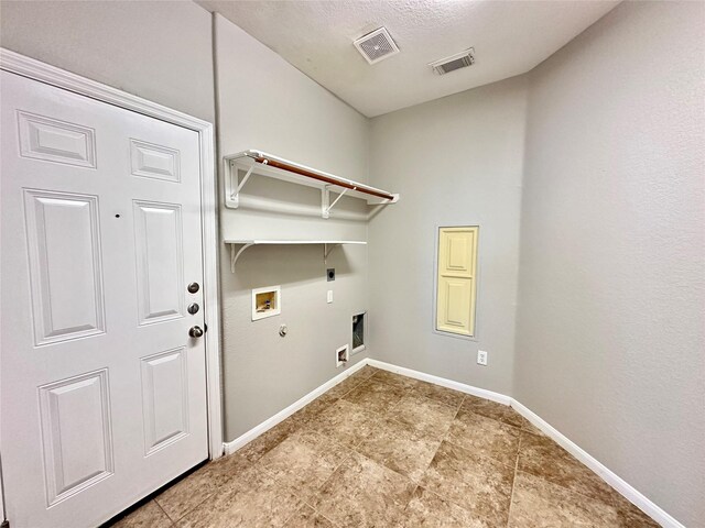 laundry area with washer hookup, hookup for a gas dryer, light tile patterned floors, and hookup for an electric dryer