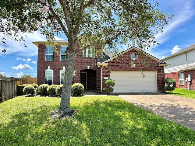 view of front of property featuring a garage and a front yard