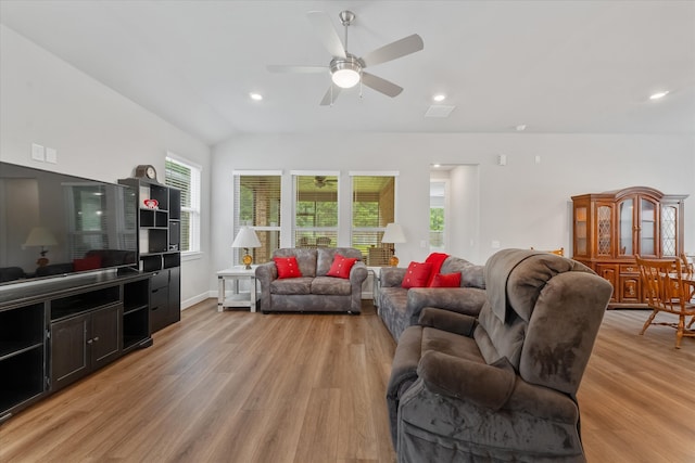 living room featuring a healthy amount of sunlight, ceiling fan, and light hardwood / wood-style floors