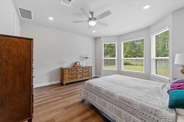 bedroom featuring ceiling fan and hardwood / wood-style flooring