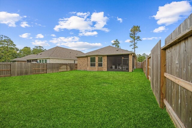 view of yard with a sunroom