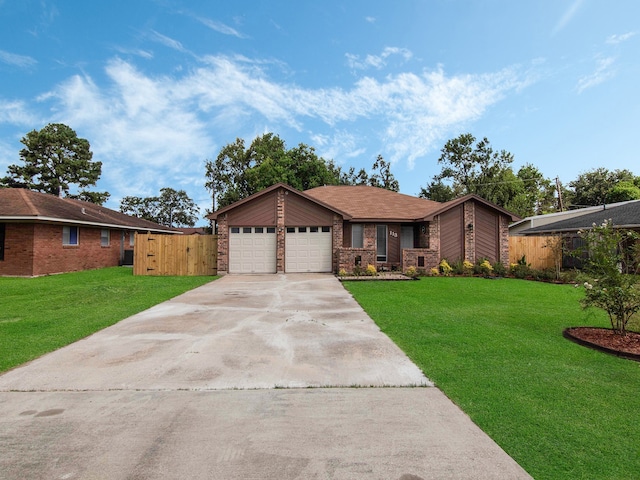 ranch-style house featuring a garage and a front lawn