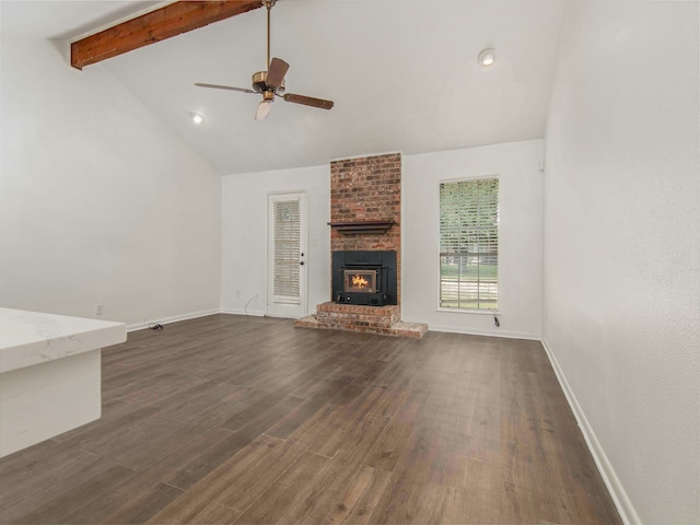 unfurnished living room featuring brick wall, ceiling fan, dark hardwood / wood-style flooring, and a brick fireplace