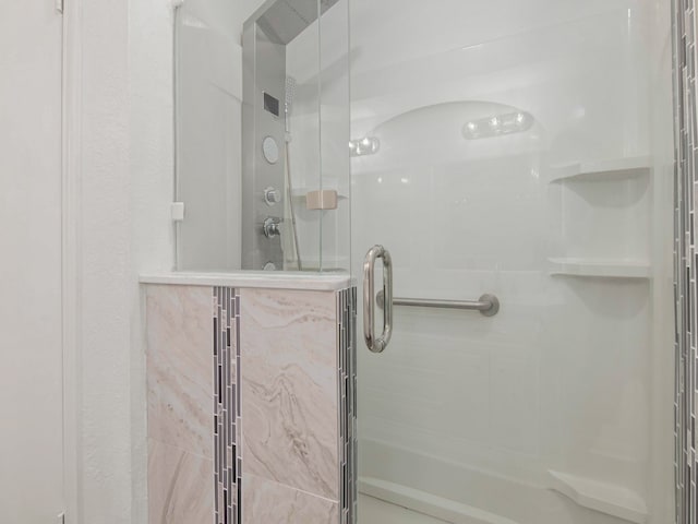 bathroom featuring an enclosed shower