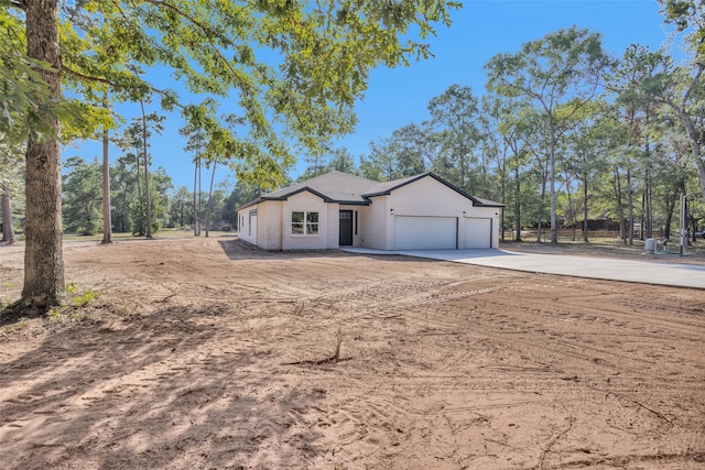 ranch-style home featuring a garage