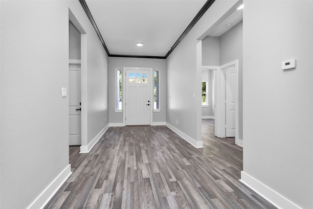 entryway featuring ornamental molding and hardwood / wood-style flooring