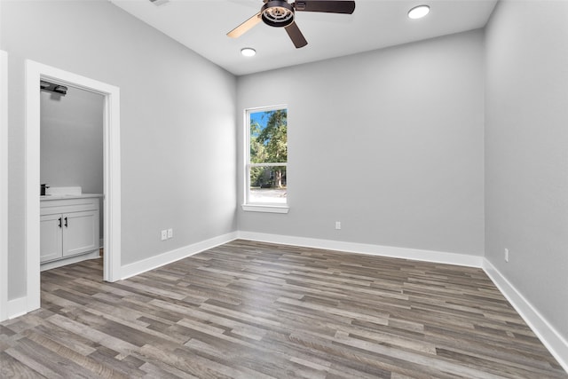 spare room featuring light hardwood / wood-style flooring and ceiling fan