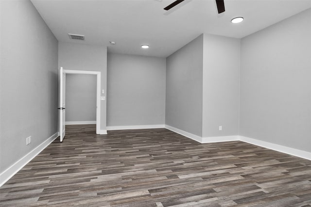 spare room with ceiling fan and dark hardwood / wood-style floors