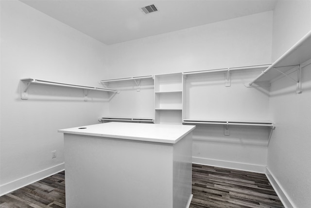 walk in closet featuring dark hardwood / wood-style flooring