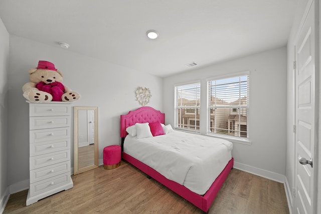 bedroom featuring wood-type flooring