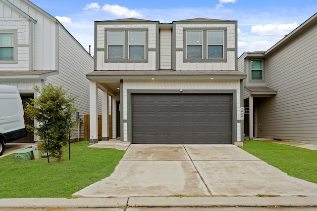 view of front of house featuring a garage and a front lawn