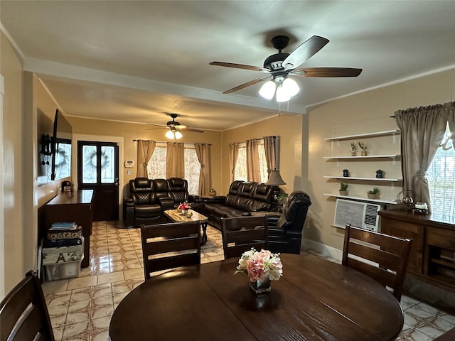 tiled dining area with crown molding, a healthy amount of sunlight, and ceiling fan